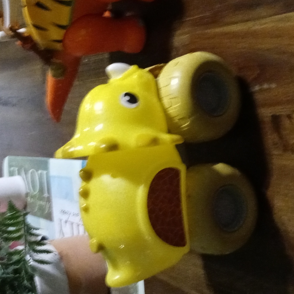 Yellow toy dinosaurs